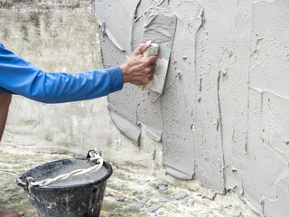Worker was Plastering The Wall of The Well