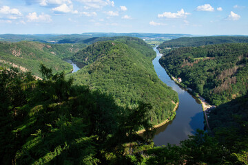 Sun shining on horseshoe bend in the Saar River on a spring day in Germany.