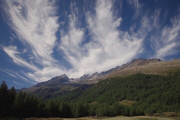 Naklejka premium View of majestic mountains and serene forests under a beautiful sky with clouds, Val Paradiso National Park, Aosta, Italy. with generative ai
