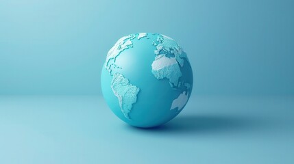 Fototapeta premium Blue miniature globe showing world continents against light blue background with soft shadow
