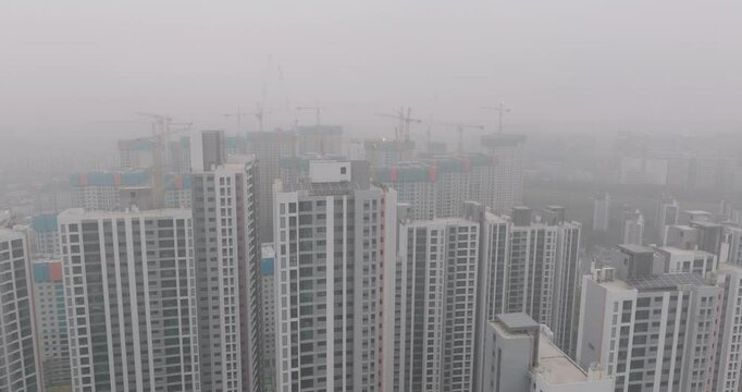 Aerial View of a Large Apartment Complex in Heavy Smog