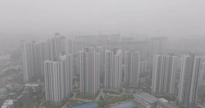 Aerial View of a Large Apartment Complex in Heavy Smog