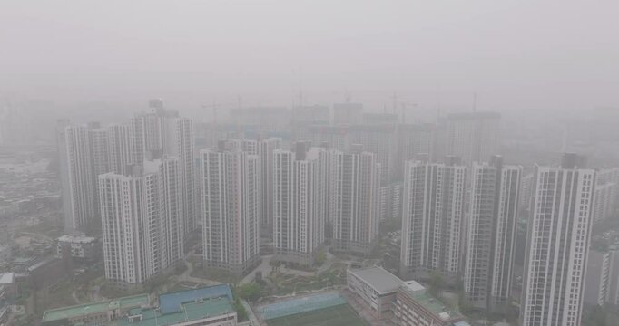 Aerial View of a Large Apartment Complex in Heavy Smog