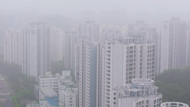 Aerial View of a Large Apartment Complex in Heavy Smog