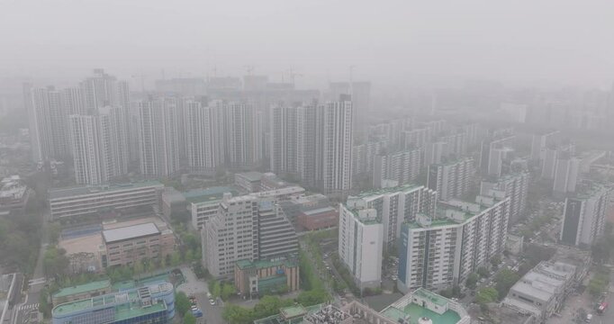 Aerial View of a Large Apartment Complex in Heavy Smog