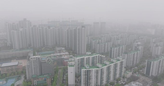 Aerial View of a Large Apartment Complex in Heavy Smog