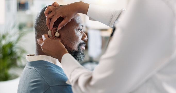 Man, ear and hearing aid with healthcare, medical support and placement with implant for sound and audio. Deaf, back and check of patient with a disability in hospital for technology and installation