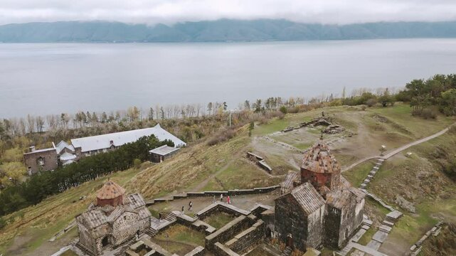 Aerial view Sevanavank monastic complex and Saint Jacob armenian chapel. Lake Sevan in the Gegharkunik Province of Armenia. Group of tourist visit popular travel sightseeing attraction