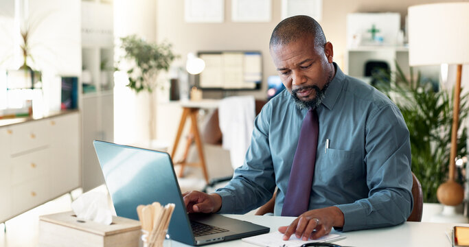 Reading, typing and man with laptop, healthcare and data entry with health records and information. Digital, documents and black person with app for research, patient navigator and online in hospital