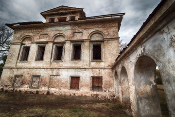 Fototapeta premium Ruins of an old abandoned building. A manor house of the early 19th century.