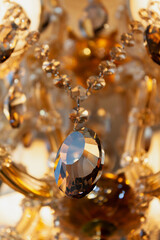 Elements of hanging crystal chandelier close-up....