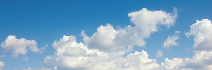 Fototapeta premium Blue sky with fluffy clouds flying high above, blue, tranquil