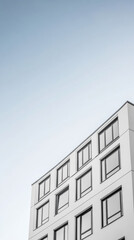 Obraz premium Modern architectural design of a building under a clear sky in an urban setting