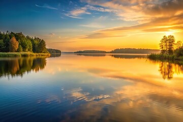 Obraz premium Soft golden light fades over a serene lake at dusk, gentle hues, peaceful evening, sunset glow, nature's beauty, fading light