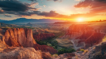 Fototapeta premium A stunning sunset over a vast canyon landscape, showcasing nature's beauty and serenity.