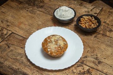 Chocolate chip cookie, Chocolate cookie with chocolate dips and ice cream flavor of vanilla and coconut dips, Chocolate cookie placed in a wooden dining table