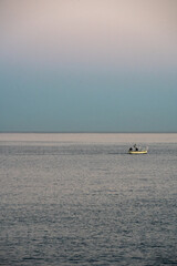 boat on the sea at sunset