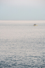 boat on the sea at sunset