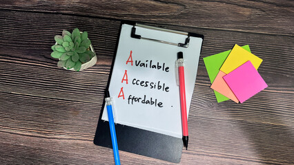 Concept of AAA - Available, Accessible, Affordable write on paperwork isolated on wooden background.