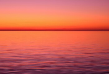Obraz premium Crimson Horizon: A Serene Sunset Over Tranquil Waters.