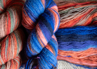 Colorful woolen yarn skeins, needlework concept, woolen threads