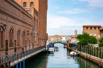 Naklejka premium Venice-la Giudeca: Unveil the magic of Venice by strolling through its intricate network of alleys, each one steeped in history and character