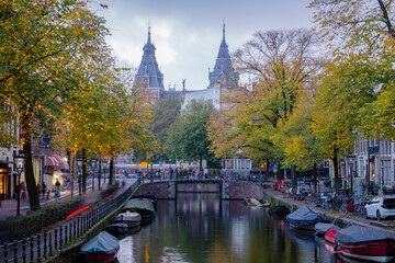 Fototapeta premium Strolling through the autumn colors along Amsterdam's picturesque canals in the Netherlands