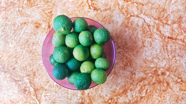 Citrus hystrix known as Jeruk purut or jeruk limau in Indonesia, in a plastic container