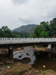 A highway bridge across the scenic Muthirapuzha River near Munnar, Idukki District, Kerala.