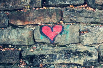 heart graffiti on a stone wall