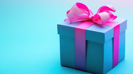 Fototapeta premium Blue gift box with pink ribbon on turquoise background