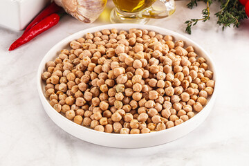 Dry chickpea seeds heap in the bowl