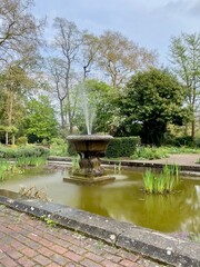 Beautiful public English Garden with a fountain and pond.  Taken on a sunny day.  