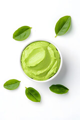 Obraz premium Bowl of guacamole with tortilla chips, isolated on white background