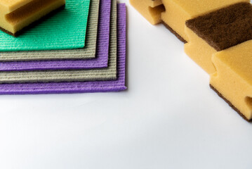 Colourful sponges with visible pores for scrubbing and cleaning.