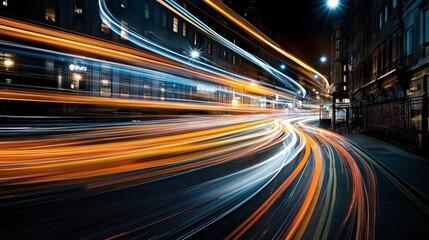 Long exposure night street scene showing colorful light trails from moving vehicles creating dynamic patterns and vibrant urban atmosphere