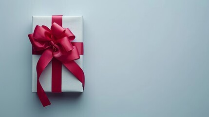 Elegant red ribbon with bow on white background for gift wrapping and greeting card decoration
