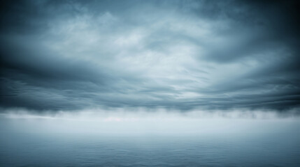 Obraz premium A blue sky with clouds and a horizon. The horizon is in the background
