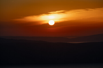 Hazy sunset over the Croatian Adriatic islands Krk and Cres.
