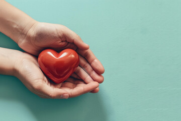 Beautiful decorative heart in strong human hands