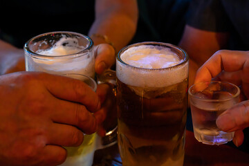 cheers with beer and soju