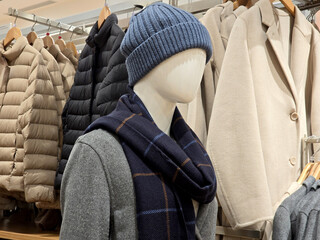 mannequins with winter clothes in a fashion store.