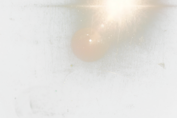 Abstract transparent  image of a bright light shining through a scratched and dirty window.