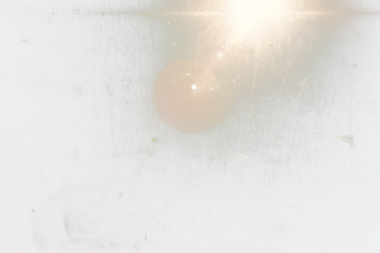 Abstract transparent  image of a bright light shining through a scratched and dirty window.