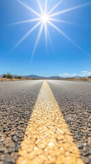 sunlit highway stretches into distance, showcasing clear blue sky and shimmering heat waves rising from asphalt. vibrant yellow line guides viewer eye along road