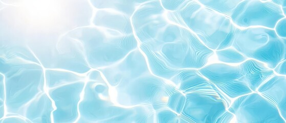 A serene turquoise water surface reflecting sunlight, evoking tranquility and relaxation in a clear summer atmosphere.