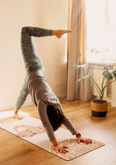 Young woman practicing yoga at home. A series of yoga poses.
