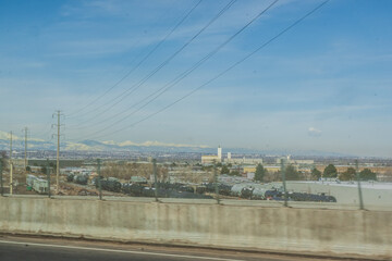 The mountains rise majestically from the freeway, as if inviting travelers to explore their vast beauty, Denver, Colorado, United States of America