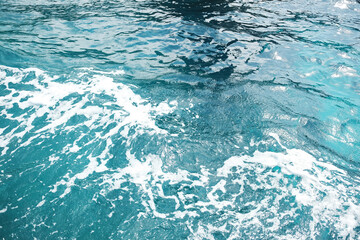 Fototapeta premium sea foam waves and splash water background and destination travel summer ocean