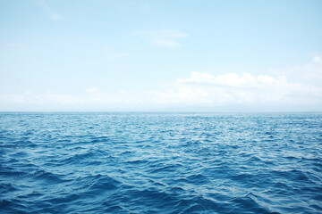 Obraz premium Landscape of horizon wave ocean and blue sea of destination travel seascape on summer beach with cloud and sky